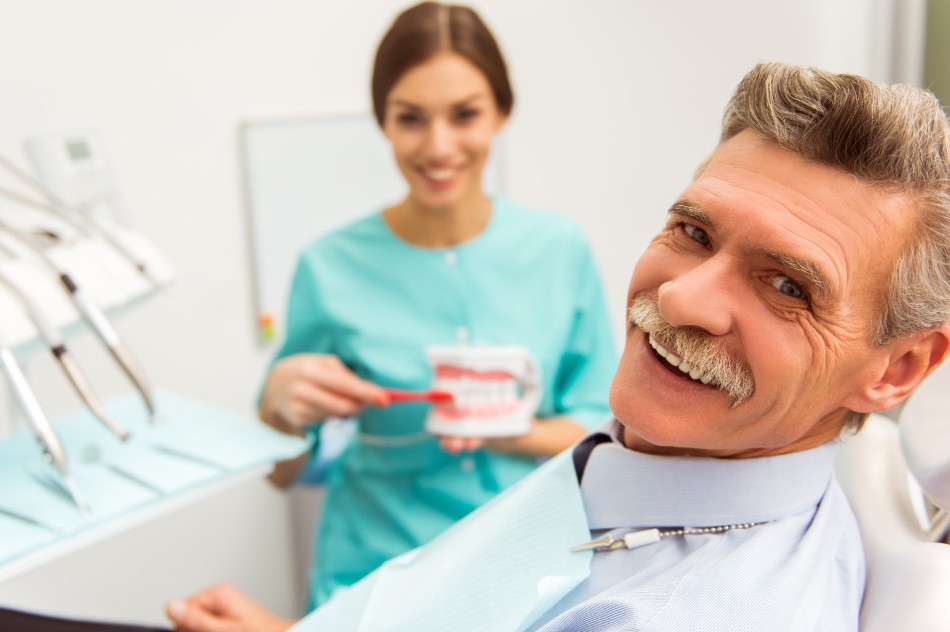 Man smiling at dentist's office